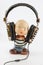 A funny rubber boy doll with headphones on it