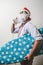 Funny santa claus babbo natale ironing surfer