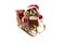 Funny santa claus dog costume inside a sleigh at Christmas holidays. Isolated on white background