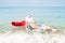 Funny Santa in the sea. Christmas in the tropics