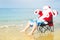 Funny Santa in shorts on the beach. Christmas in the tropics.