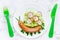 Funny sausage snail with vegetable salad, food art idea