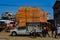 A funny scene from Madagascar`s capital, huge pile of foam mattresses on a small car transported in the market