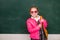 Funny school teen wearing eyeglasses backpack, child studio portrait. Education concept. Teenager younf school girl with