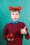 Funny schoolboy with red dumbbell and apple showing thumbs up