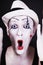 Funny screaming mime in white hat