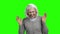 Funny senior woman is laughing on green screen.