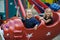 Funny sisters on carousel ride