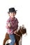 Funny small cawboy with red plaid shirt riding a play horse