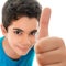 Funny small hispanic boy doing a thumbs up sign