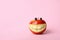 Funny smiling apple on color background