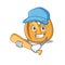 Funny smiling fortune cookie cartoon mascot playing baseball