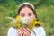 Funny spring young woman outdoor. Beautiful teen girl in a field of white flowers. Fun face emotions. Girl with a