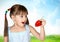 Funny surprised child girl with strawberry