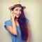 Funny surprising woman in hat talking on telephone with smile. T