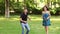 Funny teenagers play in big game ring toss in park