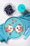 Funny toasts in a shape of kissing fishes, sandwich with cream cheese and berries, milk and blueberries, food for kids idea