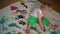 Funny toddler child with dirty hands painting on floor and clothes