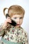 Funny toddler girl talking mobile cell phone