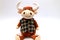 Funny toy orange Bull sits on white background. Beautiful bull with big white horns, space for text