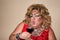 Funny travesty actor. Drag queen and red wine. Feelings and emotions