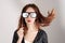 Funny trendy fashion girl with paper glasses playing with emotion