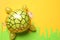 Funny turtle made of grapes on color background, top view. Space for text