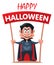 Funny vampire holds Happy Halloween banner.