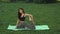 Funny video about young woman doing yoga exercise and fooling around outdoors in park at morning.