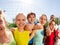 Funny view of teens standing near volleyball net