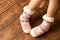 Funny warm socks on the little girl`s feet