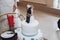 Funny wedding cake topper, figurines of bride and groom tied together with a rope, fun wedding moment with delicious white cake