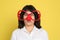 Funny woman with clown nose and large glasses on background. April fool`s day