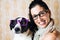 Funny woman and dog with glasses portrait