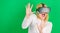 Funny woman experiencing 3D gadget technology - close up. Woman using virtual reality headset. Happy woman exploring