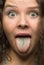 Funny woman with green tongue