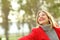 Funny woman joking in a park in winter