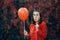 Funny Woman with Paper Party Glasses and Red balloon