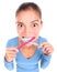 Funny woman with two toothbrush brushing teeth