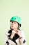 Funny woman wearing cycling helmet portrait pink background real