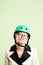 Funny woman wearing cycling helmet portrait pink background real