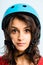 Funny woman wearing cycling helmet portrait real people high def