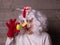 Funny women in strange chicken costume asking - Which came first Chicken or Egg