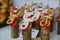 Funny wooden moose deers with red noses and Santa hats