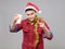 Funny young drunk man wearing Santa hat holding a paper cup