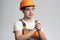 Funny young foreman on grey isolated background rubs his hands and ready to start working