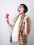 Funny young man screaming playing video games holding a joystick isolated on gray background