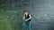 Funny young man student dancing having fun near chalkboard with formulas