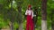 Funny young mime walks on stilts and juggling