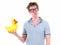 Funny young nerd man with eyeglasses holding inflatable duck and looking bored